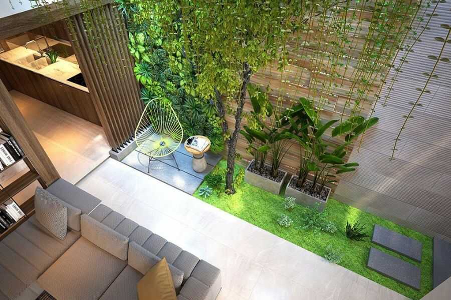 Trang trí cây xanh trên tường làm tiểu cảnh bồn cây phong cách nhiệt đới