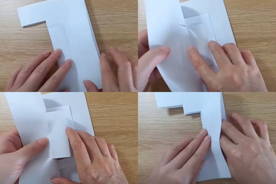 Đẩy phần giấy đã gấp ngược vào trong và làm phần bên kia tương tự.