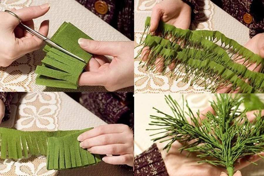 Bạn cắt giấy nhún thành những dải nhỏ và xoắn chúng lại làm lá cây thông.