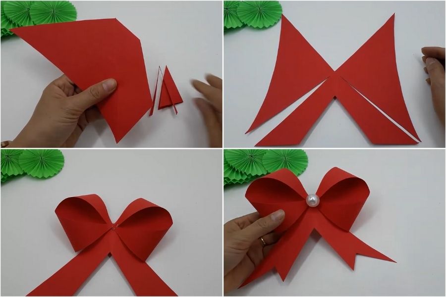 Tạo hình nơ bằng tờ giấy màu đỏ để tạo điểm nhấn cho chiếc vòng nguyệt quế.