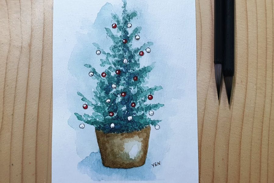Dùng màu nước để vẽ cây thông Giáng Sinh.