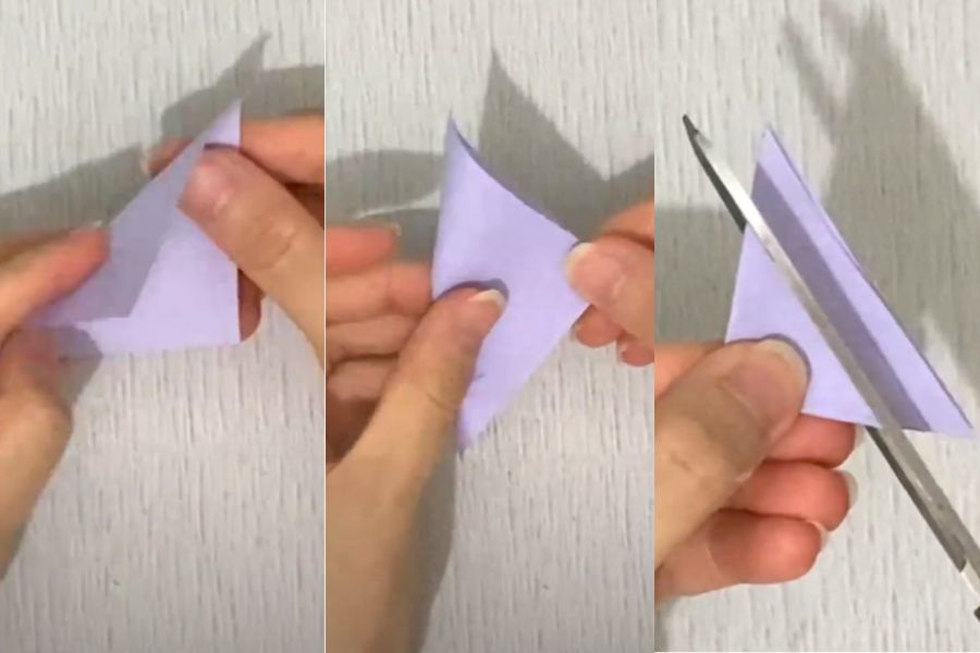 Xếp giấy thành hình tam giác và dùng kéo cắt 3 đường song song mép cạnh.
